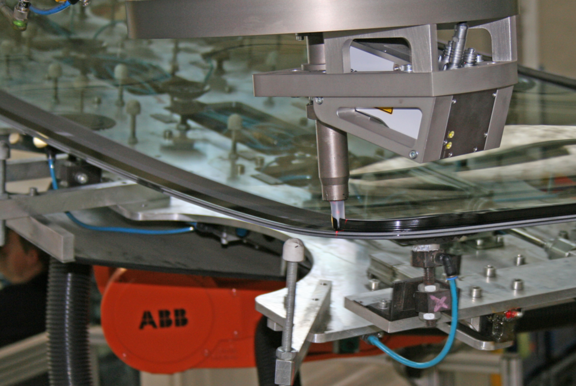 scanCONTROL mounted on robot inspecting the glue bead on an automotive production line